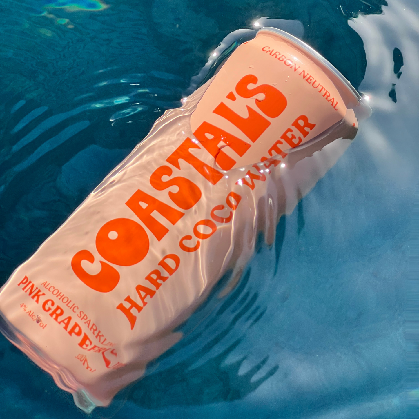 Coastals hard coconut water can floating in water