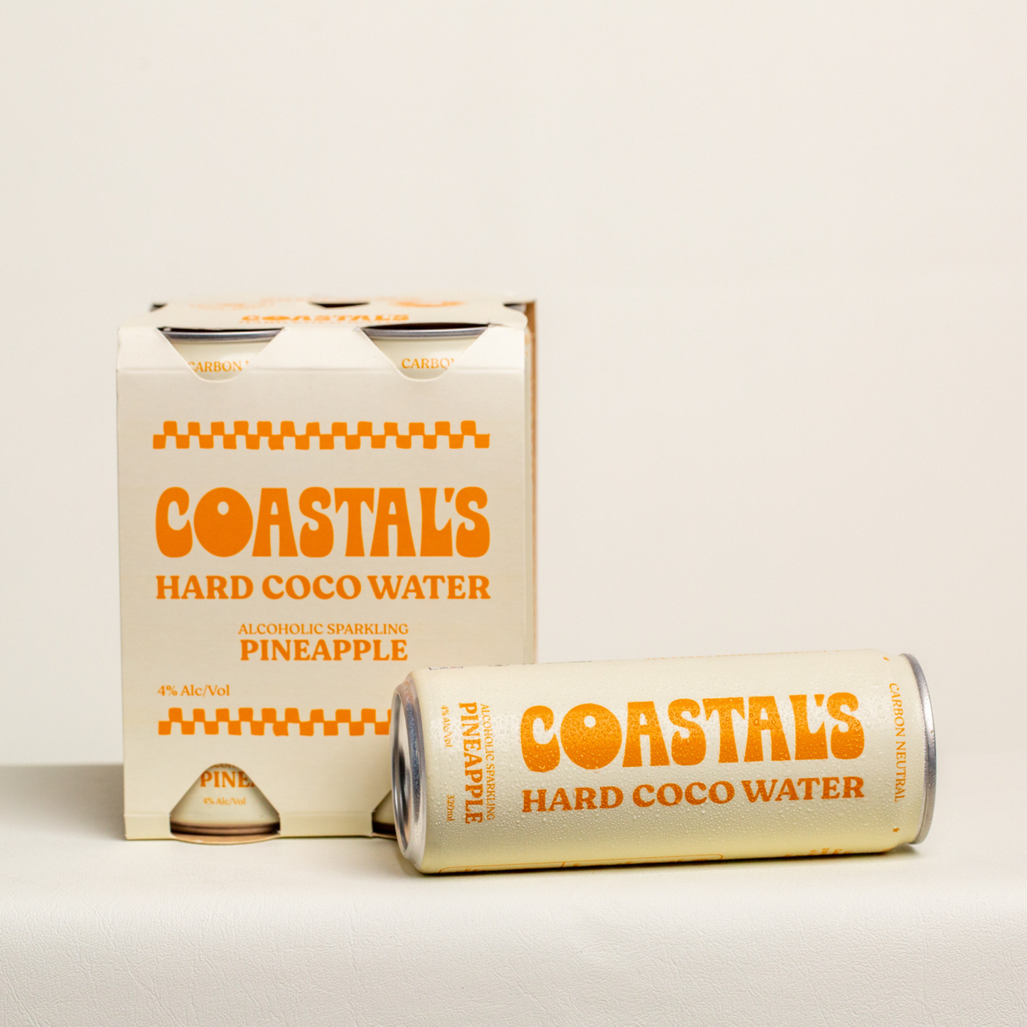A 4-pack of Coastals Pineapple Sparkling Alcoholic Coconut Water with vodka and real pineapple juice next to a single can, displaying the brand and flavour.